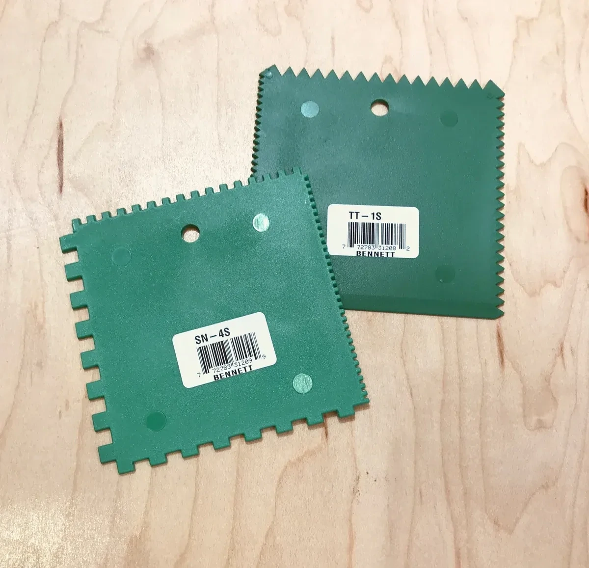 1/8 inch x 3 inch V-notch grout spreader.