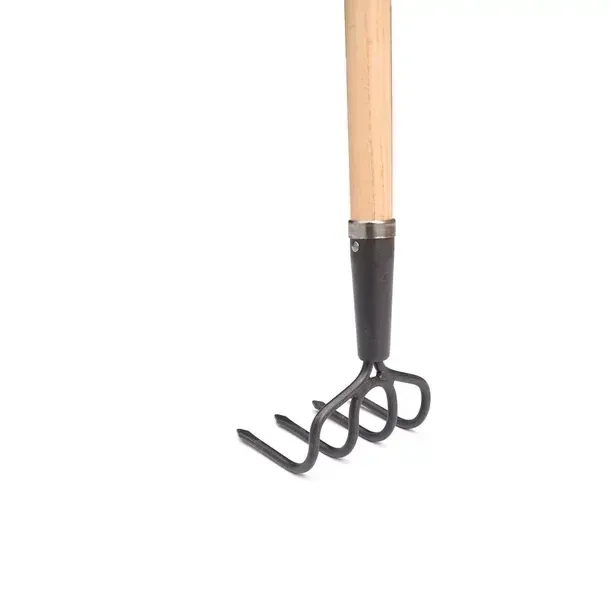 4 tine hand cultivator for breaking up garden soil.