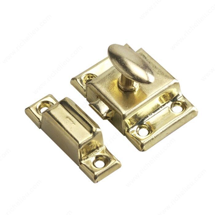 Brass cupboard latch for keeping cabinet doors securely shut.