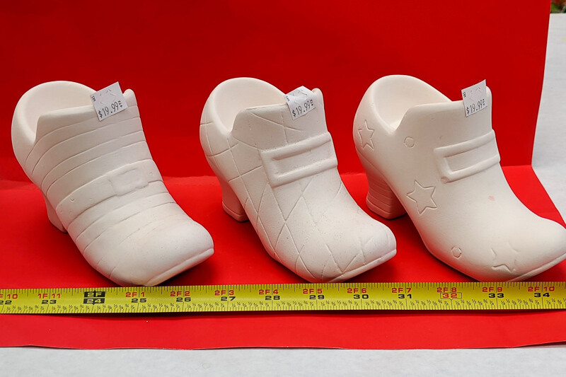 Shoe to paint your own DIY plaster figurine Art Craft activity with paint and brushes.