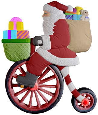 Santa on a Bicycle Santa Clause Christmas Plaque with paints and brushes. Paint your own DIY plaster figurine Art Craft activity.