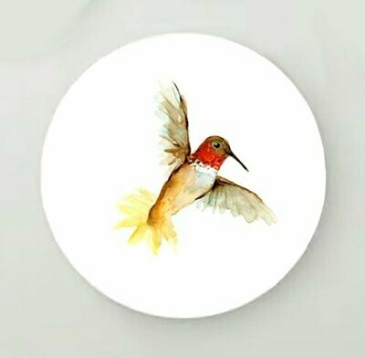 Round print of a yellow and red hummingbird painting