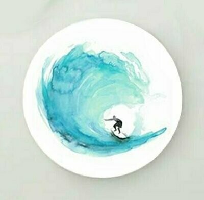 Circular wall art of a teal surf painting