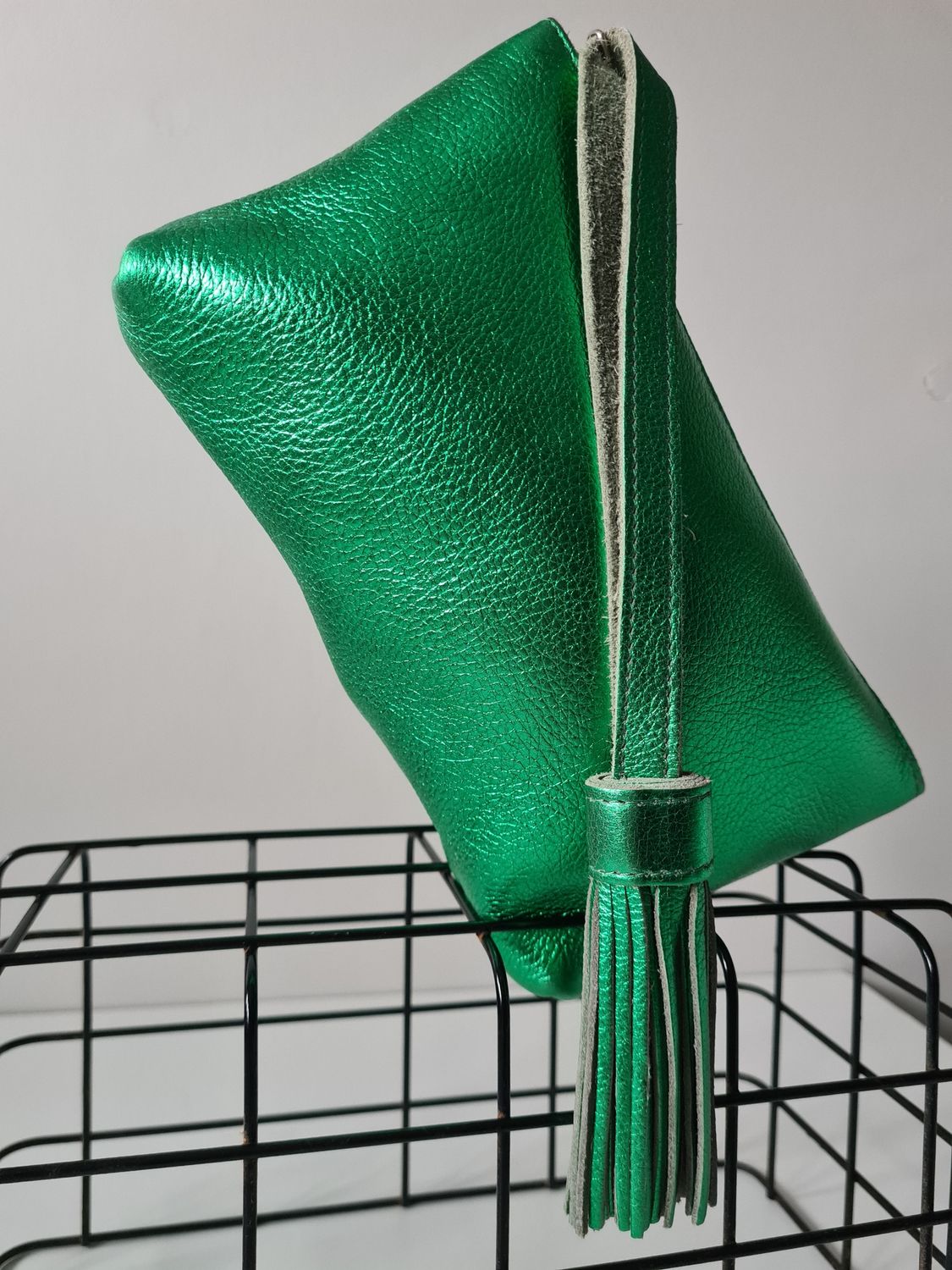 Metallic green leather wristlet bag
