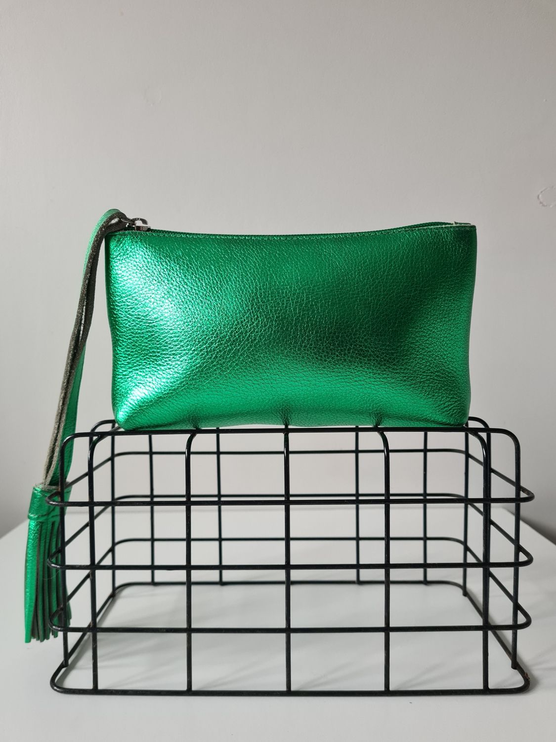 Metallic green leather wristlet bag