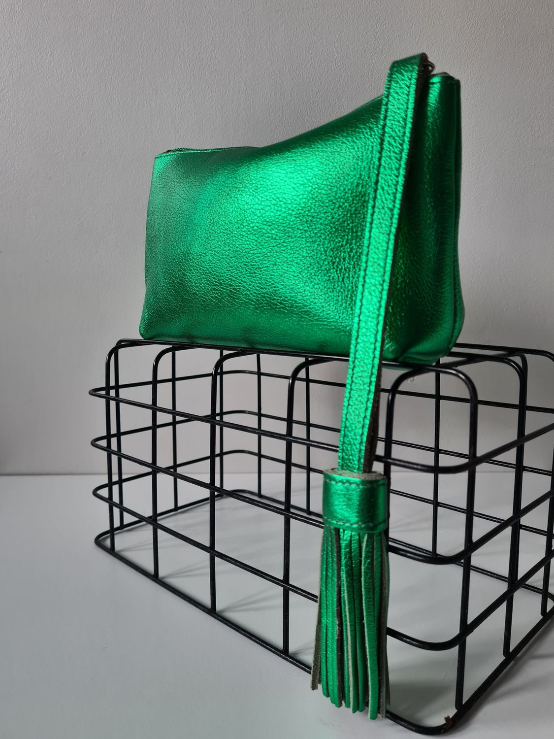Metallic green leather wristlet bag