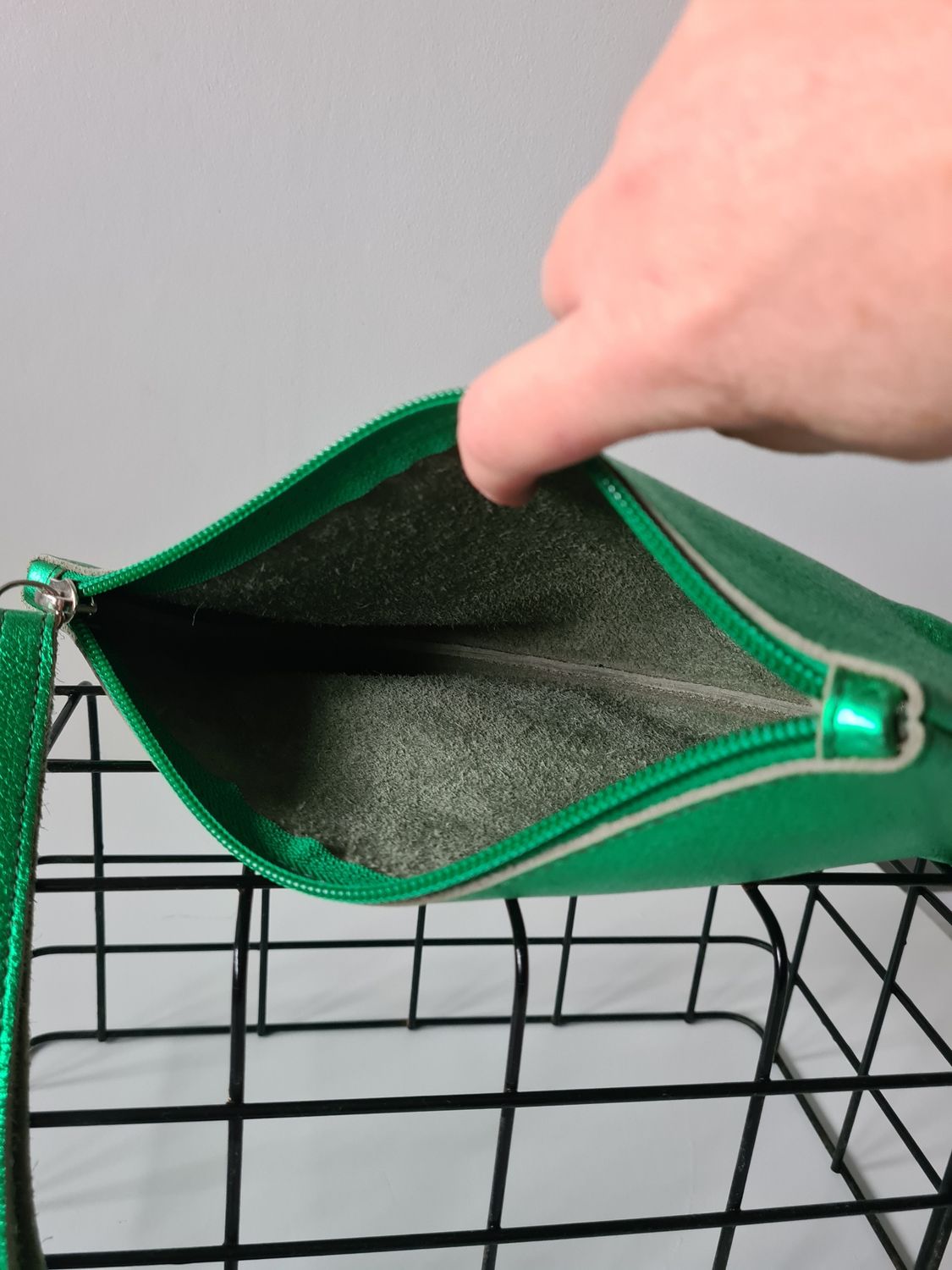Metallic green leather wristlet bag