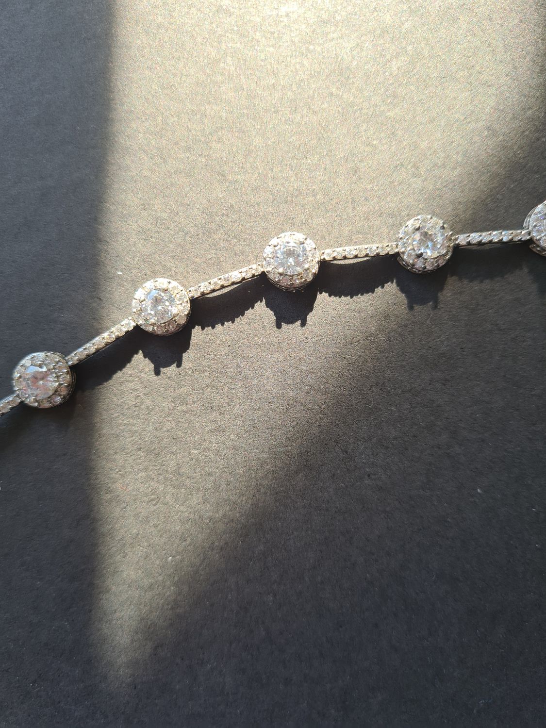Stunning Halo design silver tennis bracelet