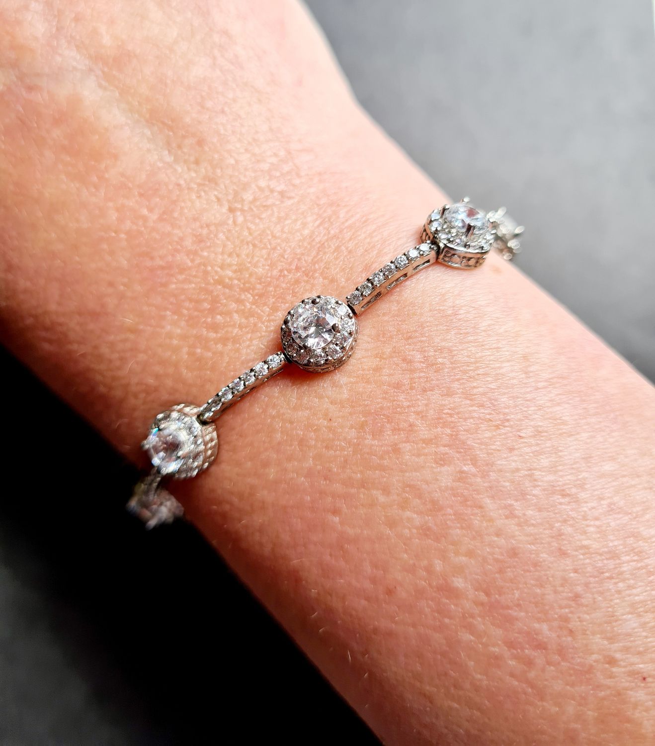 Stunning Halo design silver tennis bracelet