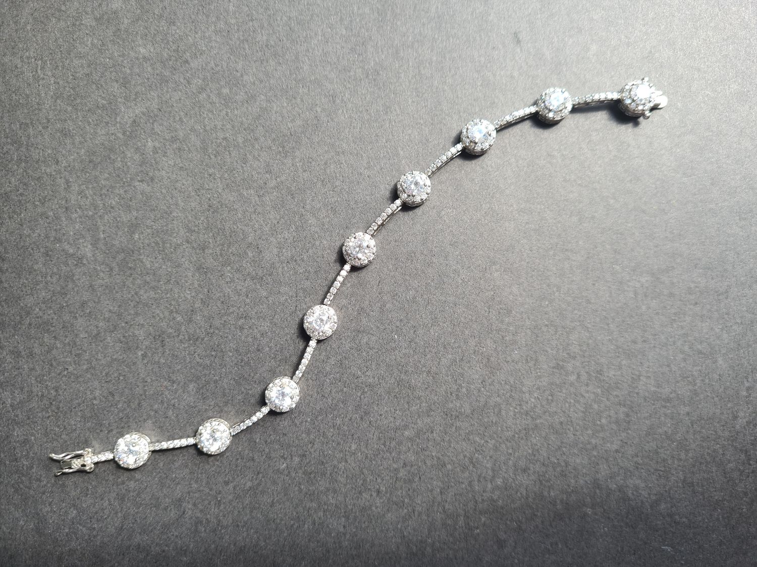 Stunning Halo design silver tennis bracelet