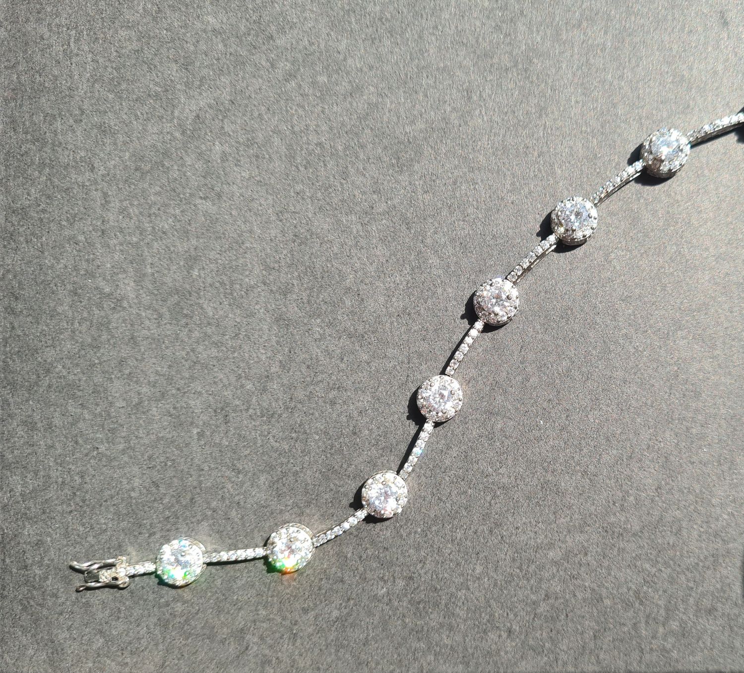 Stunning Halo design silver tennis bracelet