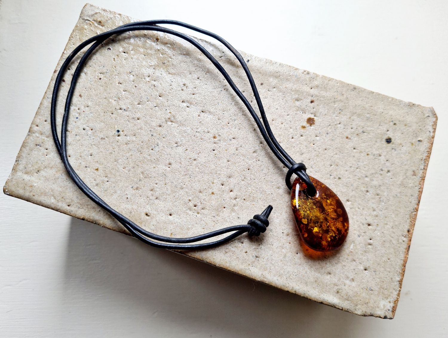 Organic shaped Amber on leather cord
