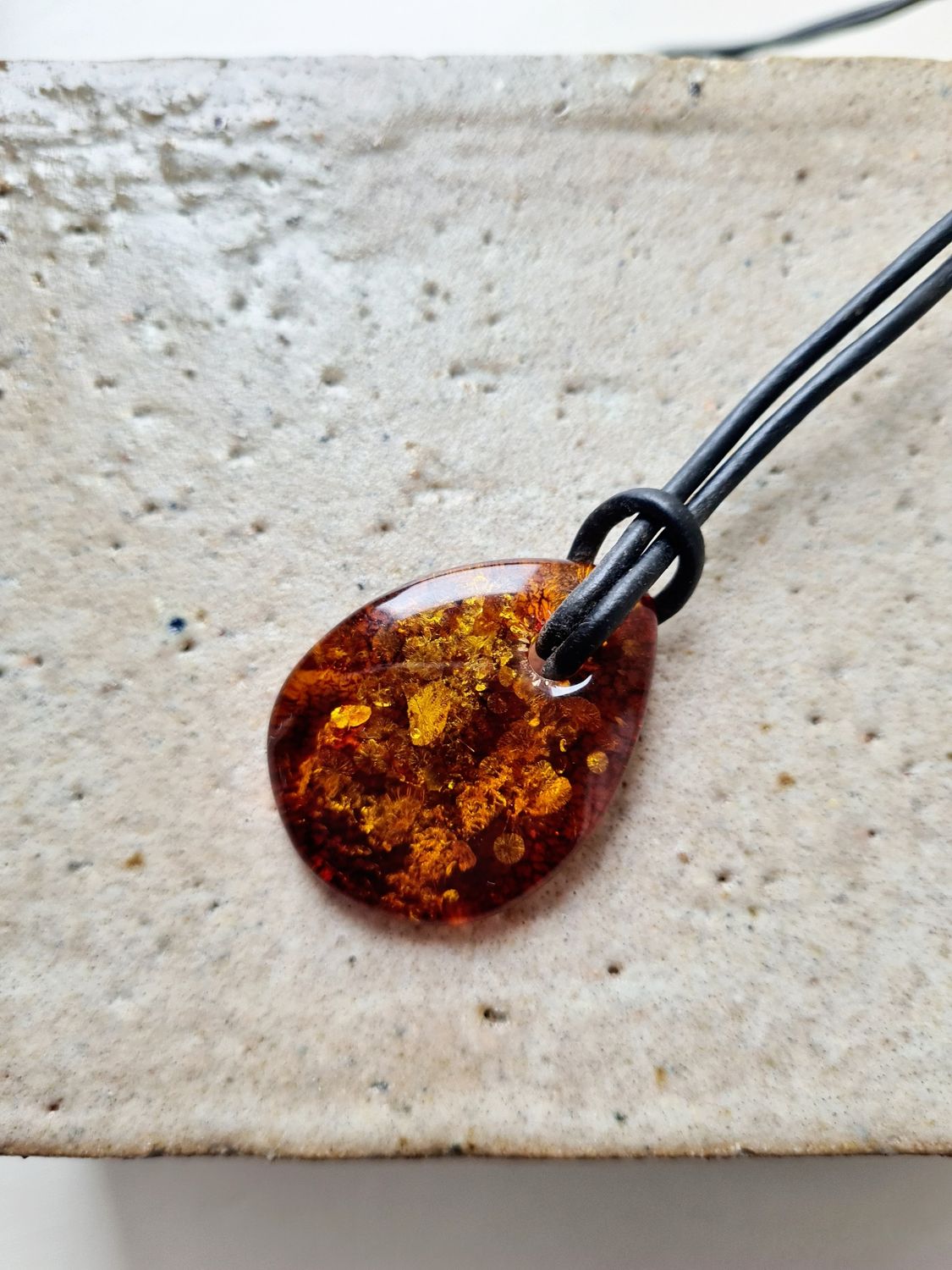 Organic shaped Amber on leather cord