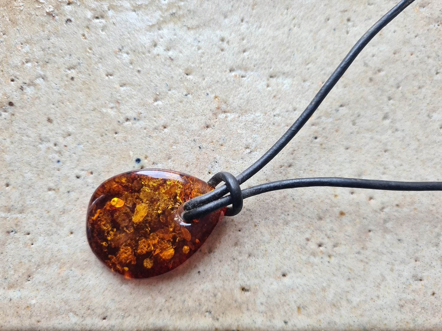 Organic shaped Amber on leather cord