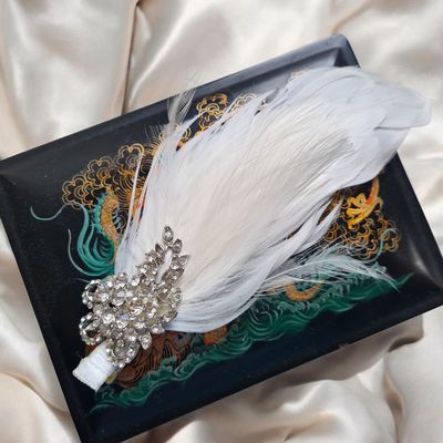 Feather and rhinestone hair fascinator