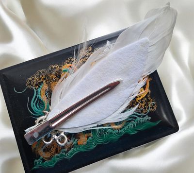 Feather and rhinestone hair fascinator