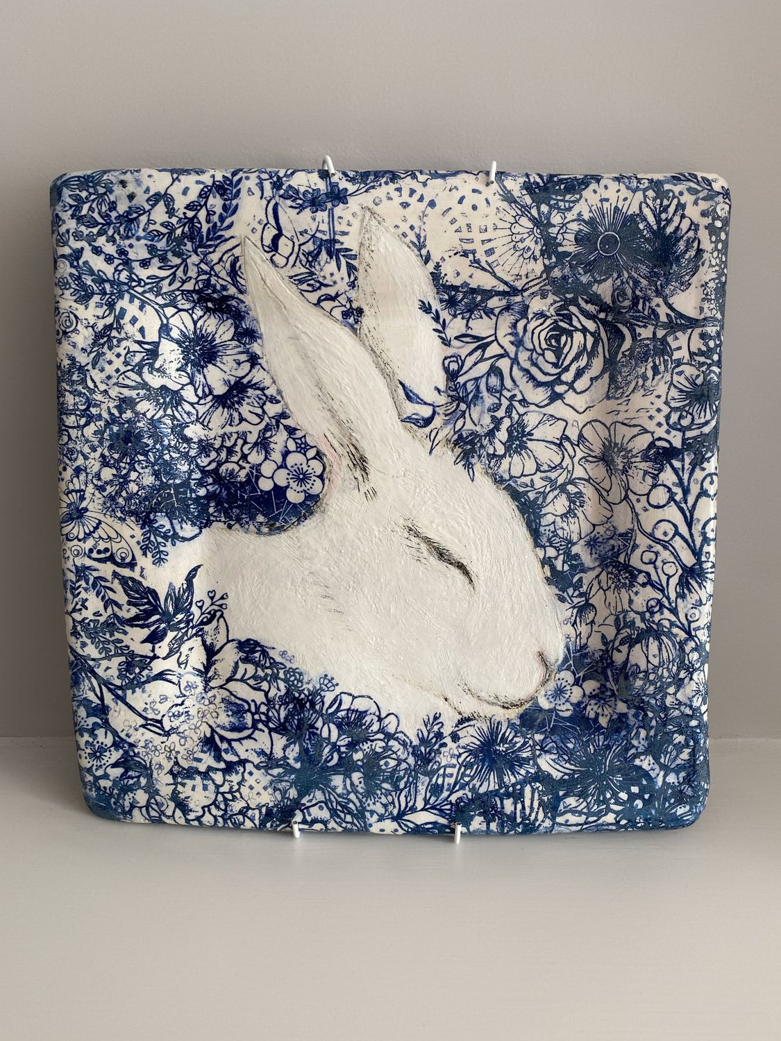 White rabbit blue botanical square wall plate.