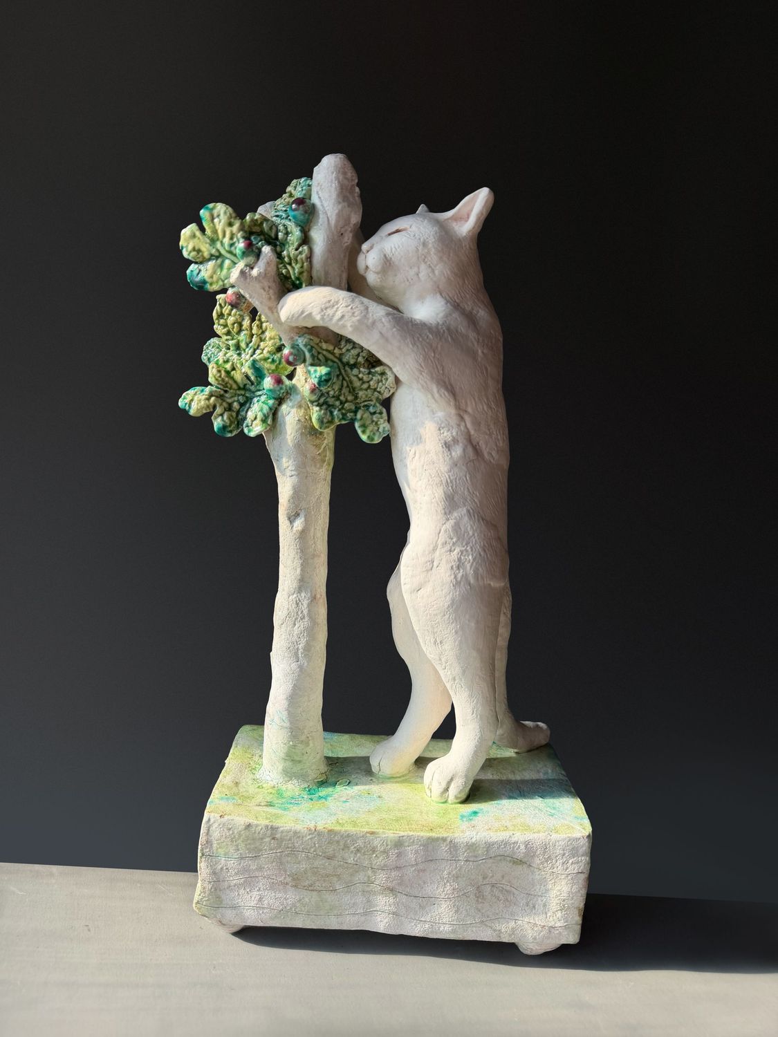 white cat with fig tree white cat with fig tree