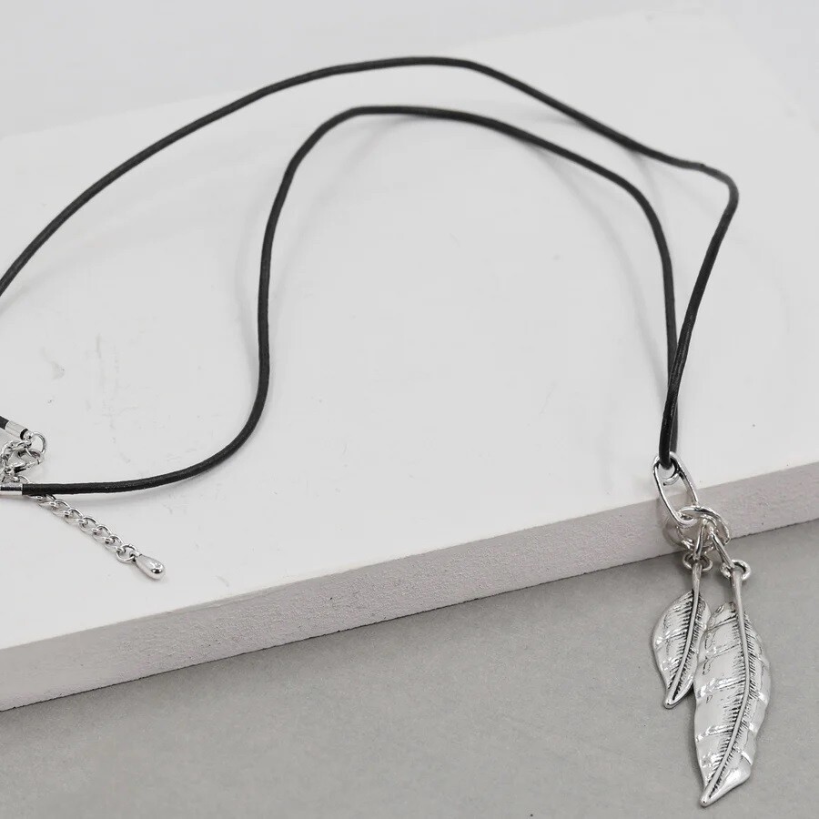 FEATHER PENDANT ON LONG BLACK LEATHER NECKLACE