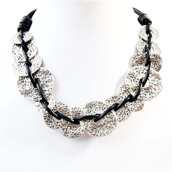 Beaten interlinked donut shapes on leather