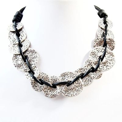 Beaten interlinked donut shapes on leather