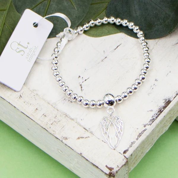 Stretchy Beaded Bracelet With Agnel Wing Charm