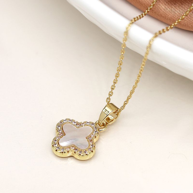 Pom Golden crystal edged quatrefoil necklace