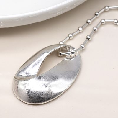 Pom Silver plated station and worn oval necklace