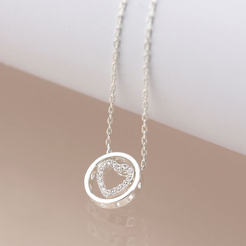 Pom Silver plated crystal heart in circle necklace