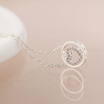 Pom Silver plated crystal heart in circle necklace