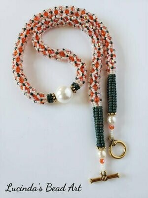 Netted Necklace in Orange, Ivory and Green with Shell Pearl Center