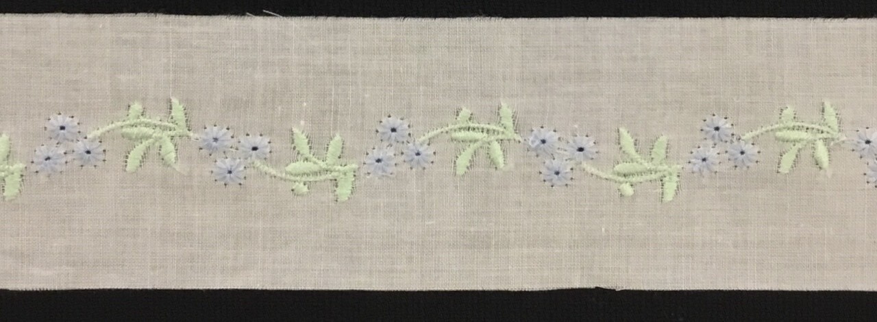 263 White swiss trim insertion with blue flower  (Priced Per Yard)