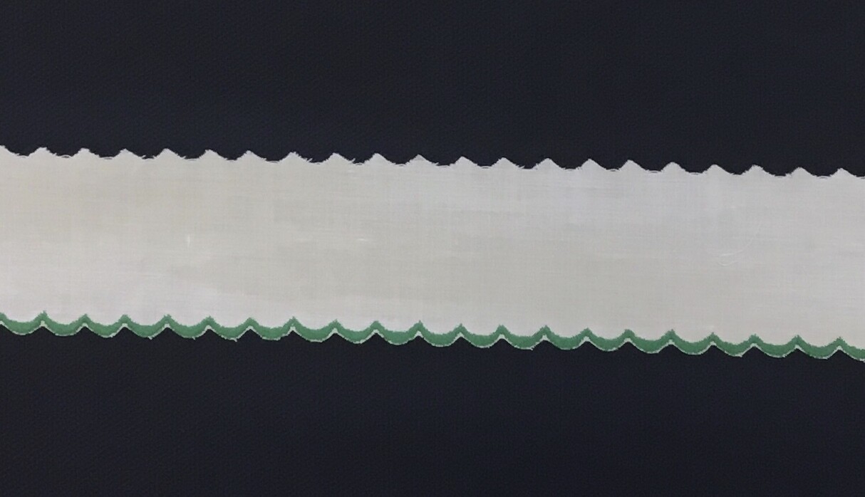 217 Ecru Swiss  edging green (Priced Per Yard)