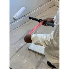 The RollerBagger Paint Roller Frame Extension Handle Bag Dispenser