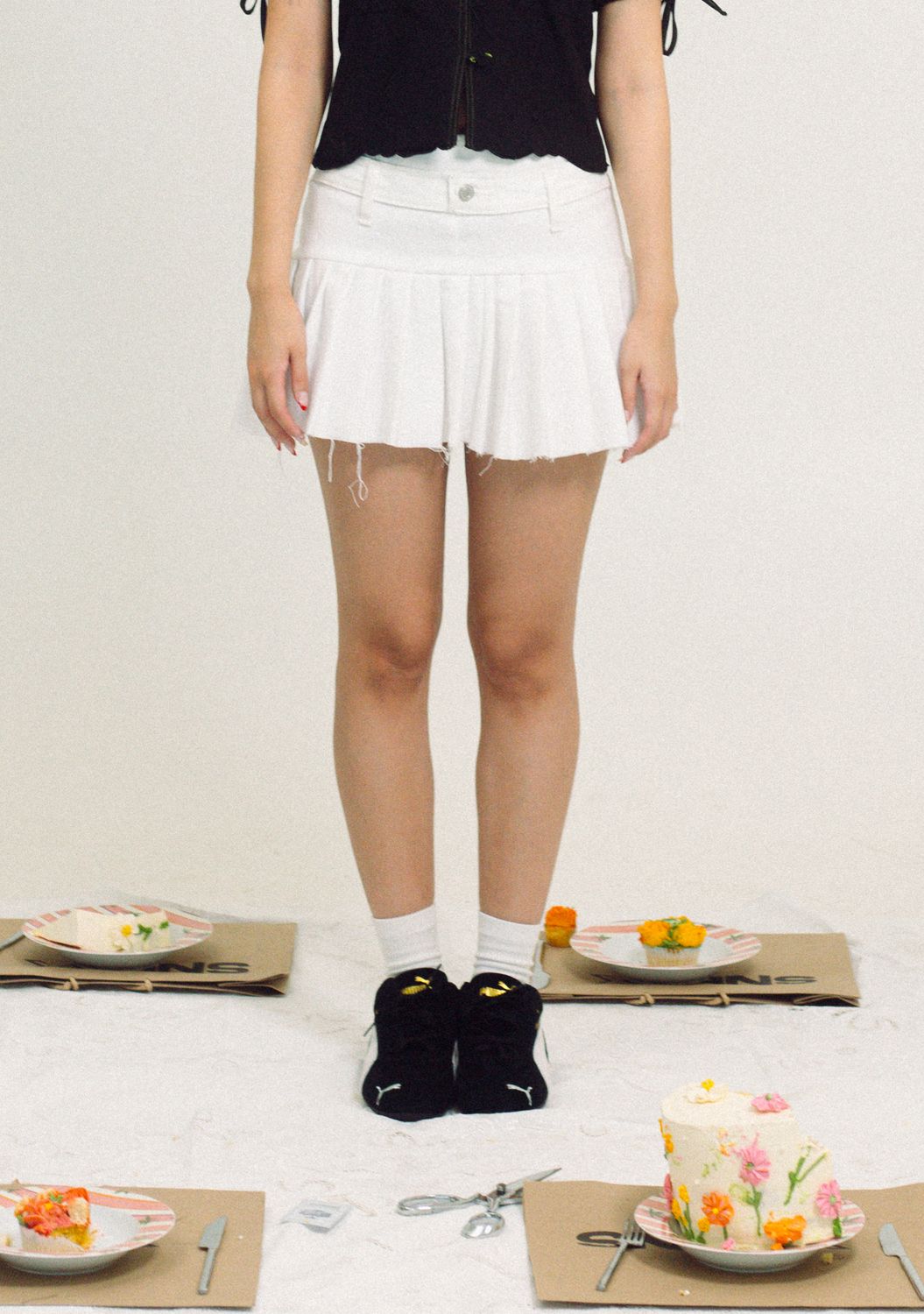The White Pleated Mini Skirt