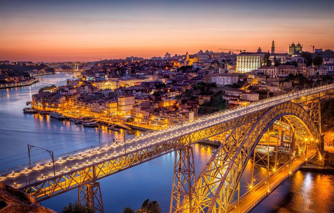 Dom Luís I Bridge, the Douro River and Porto at sunset, viewed from Vila Nova de Gaia.