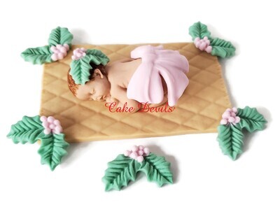 Fondant Baby with Holiday Bow and Holly Berries for a Christmas Baby Shower or Pregnancy Announcement