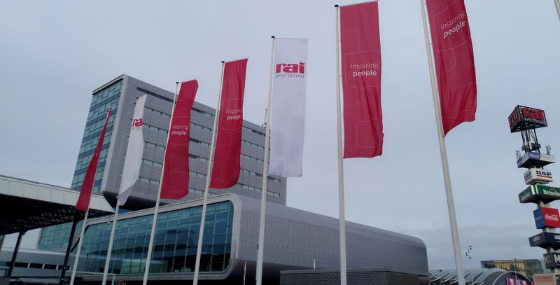 Outside RAI Exhibition center in Amterdam, a few flags are hanging in front of the tradeshow center itself