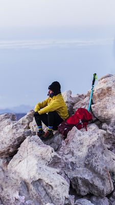 Man resting in the mountains during a hike