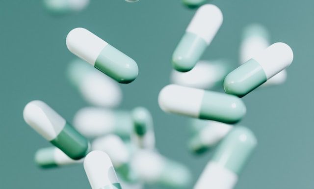 Neutraceuticals artistic picture with capsules in colours green and white
