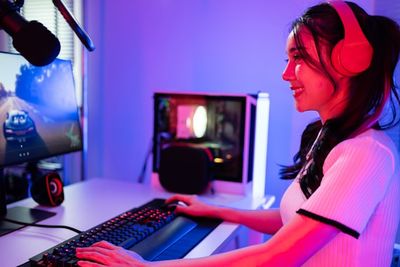 Young lady busy gaming