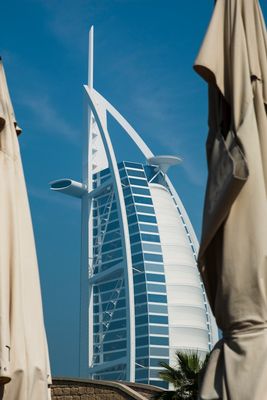 View of Burj al Arab through 2 closed 'sun umbrellas', one on each side of the picture