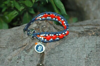 DTS-1021
Detroit Tigers- Blue leather with orange czech candy beads, orange dangle bead and Old English D logo charm