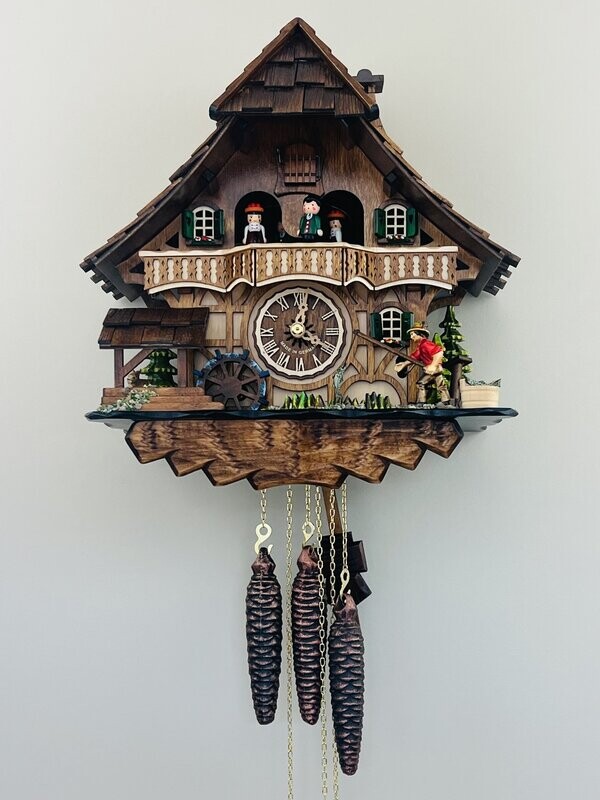 13" One Day Musical Cuckoo Clock Cottage - Fisherman Raises Pole and Moving Waterwheel