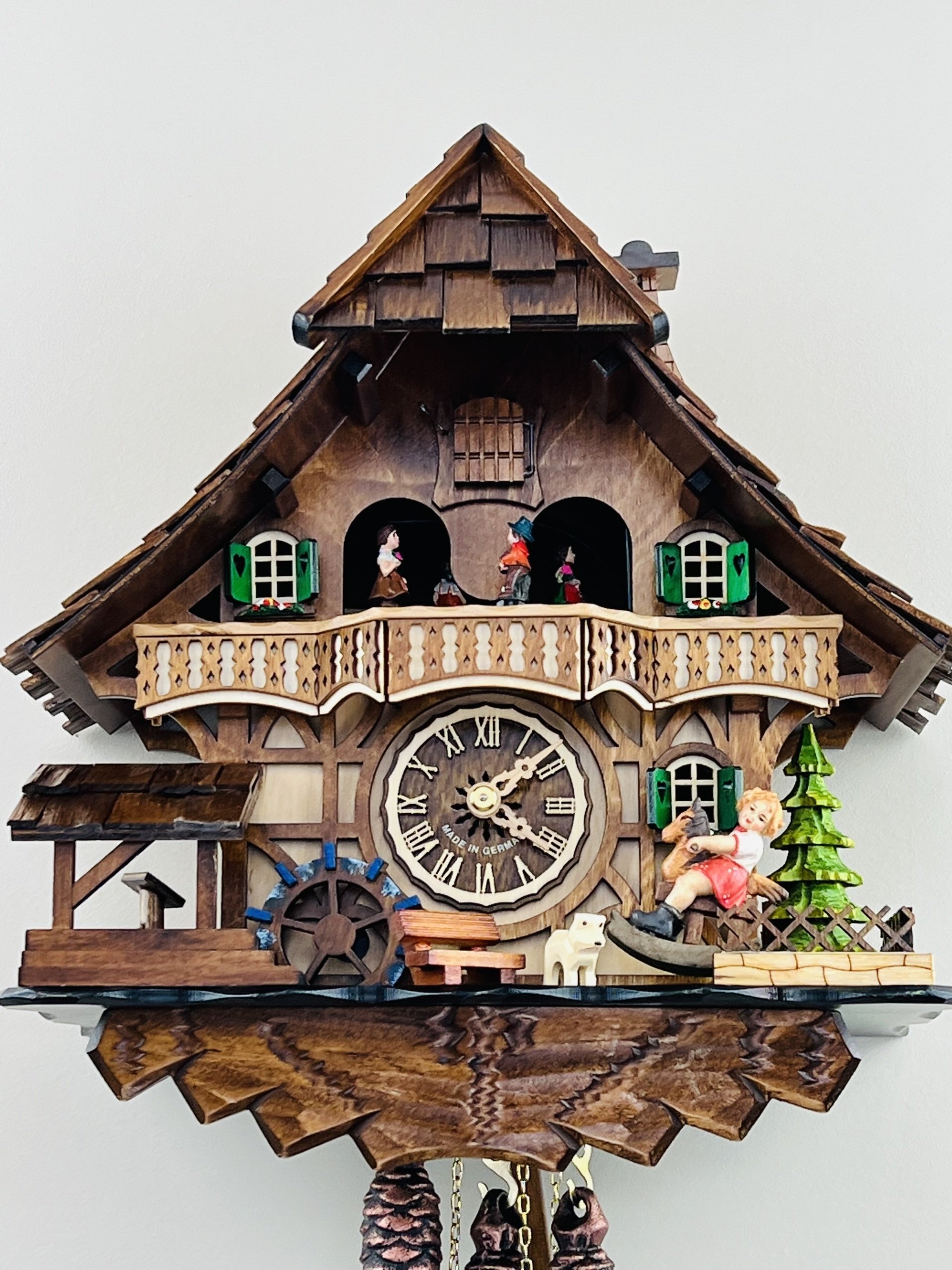 13" One Day Musical Black Forest Cuckoo Clock with Dancers, Waterwheel, and  Girl on Rocking Horse