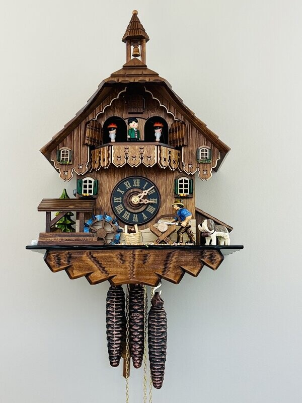 14" One Day Musical Cuckoo Clock Cottage with Man Sawing Wood, Waterwheel and Dancers