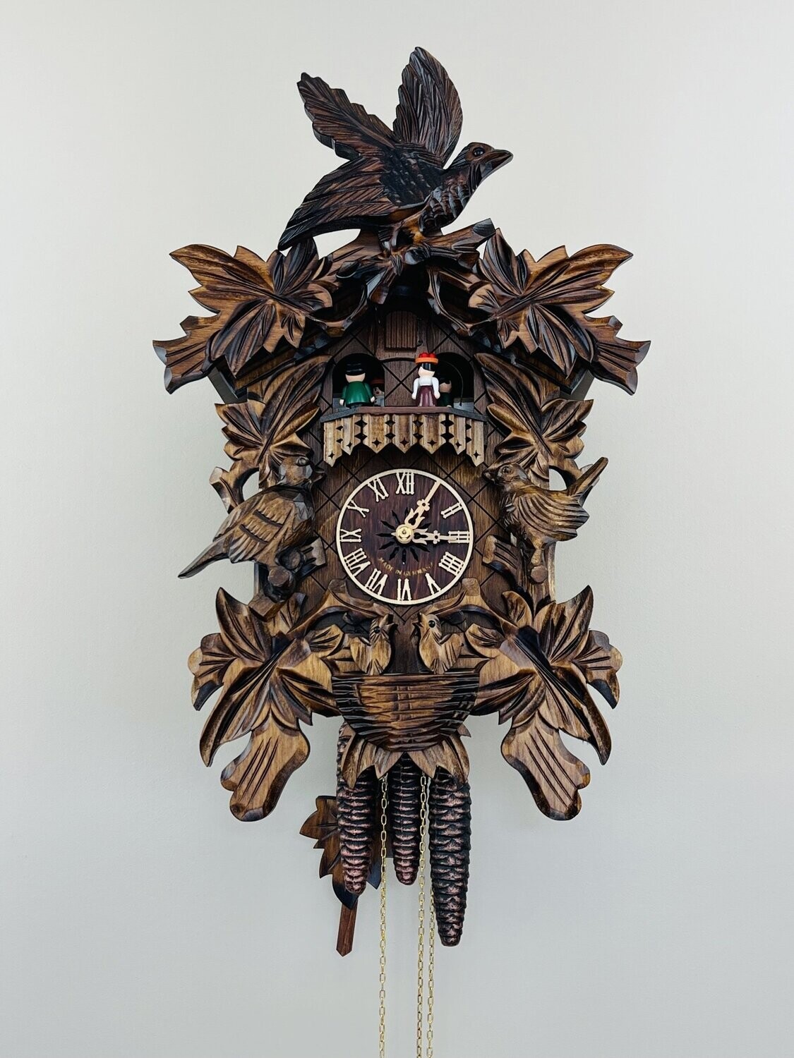18" One Day Musical Cuckoo Clock with Hand-carved Birds, Leaves, and Chicks in Nest