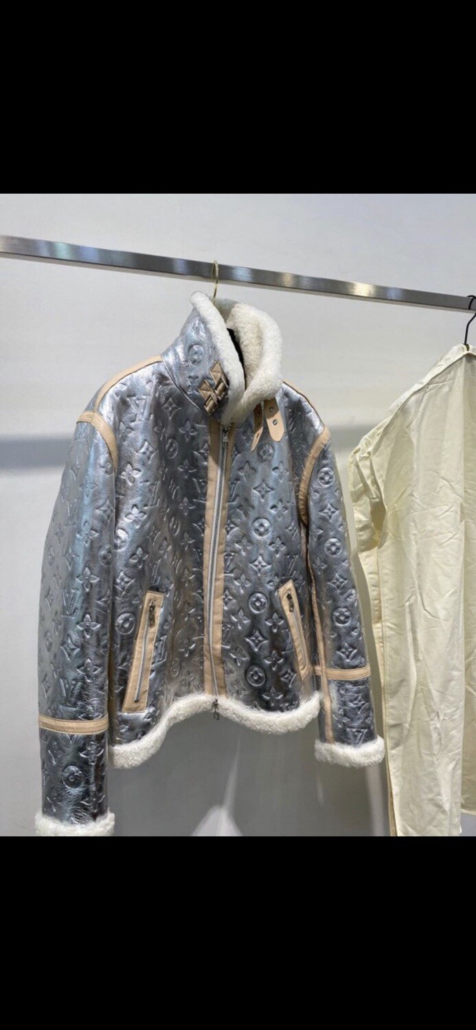Fleece lined metallic Stamped LV jacket. All the bells and whistles that keep you warm shows your style with confidence and luxury . A great item to add to your collection