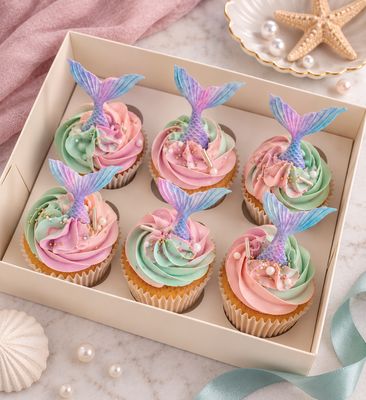 Mermaid Cupcakes Mermaid cupcakes with ocean-themed Swiss meringue buttercream decorations