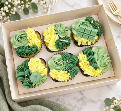 Green and Gold Designer Cupcakes Designer cupcakes with decorative Swiss meringue buttercream piping